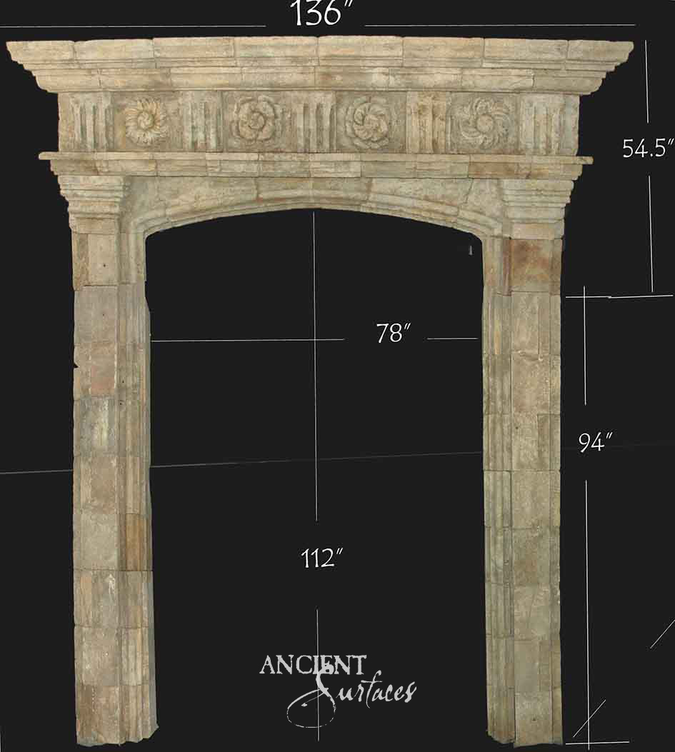 Wide limestone surround with a carved rosette frieze over a flattened Tudor arch